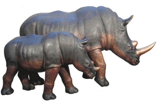 charging rhinoceros statues